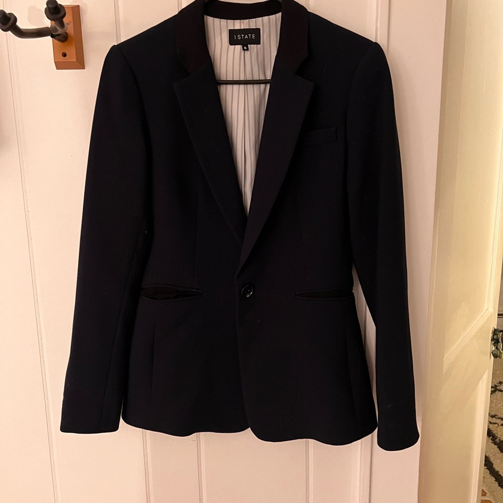1 state, navy blue jacket with silk inset and black detailIng